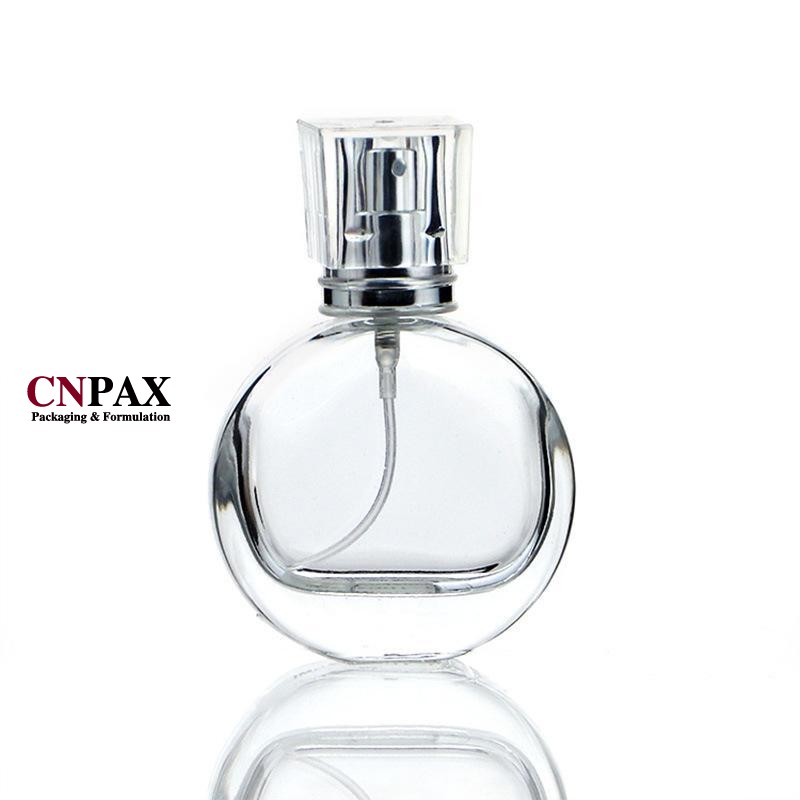 flat round glass perfume bottles