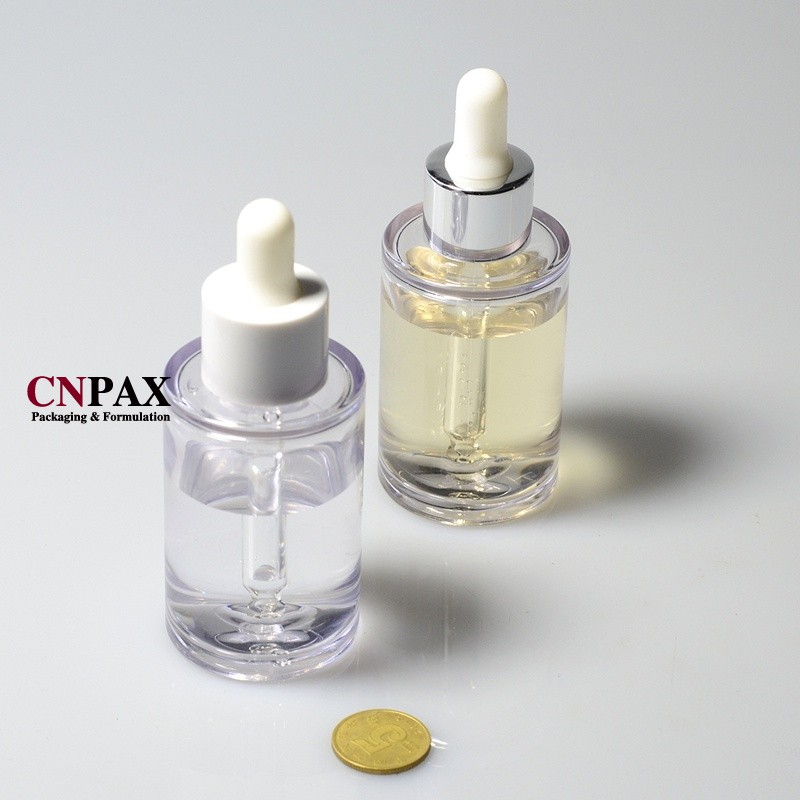 serum bottle with silver pipette dropper