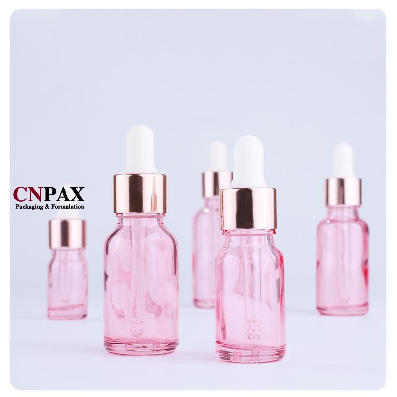 custom pink glass serum bottles with dropper in stock
